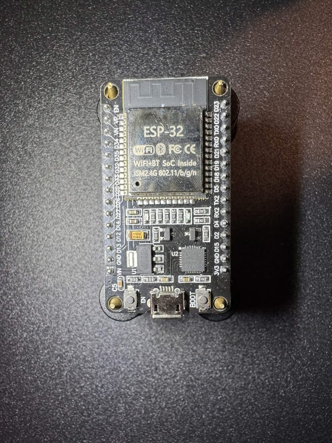 An ESP32 board on the bench, one of the radios Cyber Controller flashes and drives